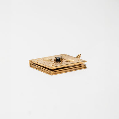 SECRET MEMORY - pendente libro porta foto in oro con pietra onice nera