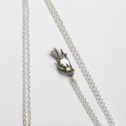 DESIRE - Hand pendant with snake and green peridot stone